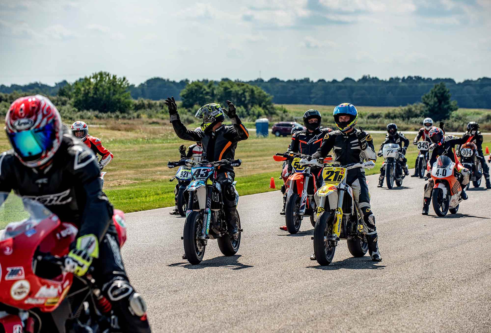 Don’t jump the start. Second wave racers hold hands up to signal “wait for it.”